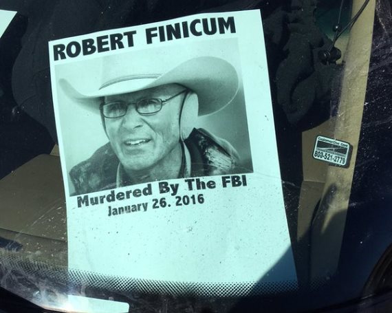A flyer behind an attendee's windshield