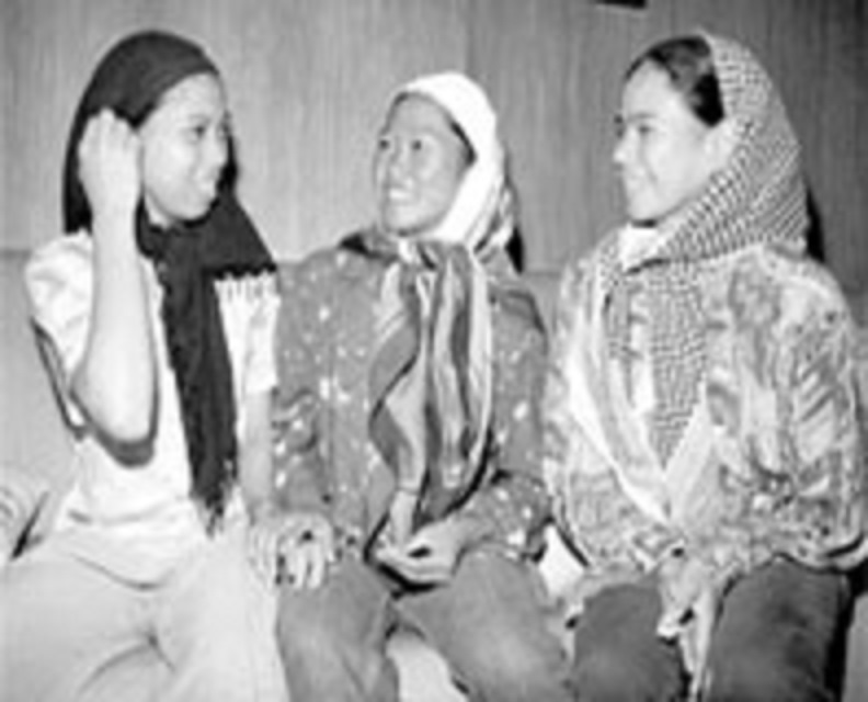 Three released Abu Sayyaf hostages, one of which is identified as Maria Fe Rosadeno. The source doesn't indicate which is which.