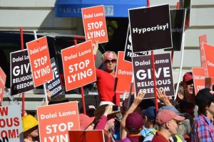 Hundreds of Buddhists Protest The Dalai Lama During US Visit