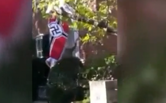 man flies Nazi flag