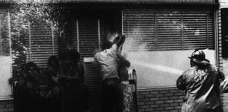 image of civil rights protesters being sprayed by a hose