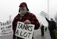 protestors on the side of the road in Spokana