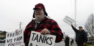 protestors on the side of the road in Spokana