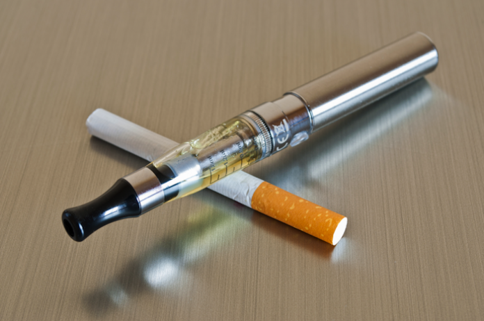 image of cigarette cross with e-cigarette