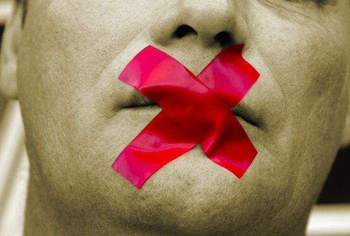 image of tape over mouth to silence speech