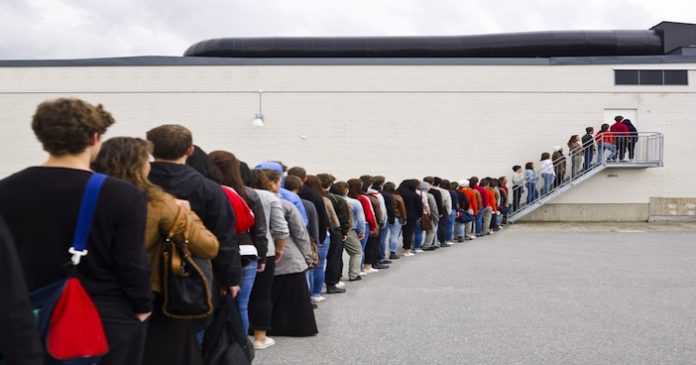people waiting in line to vote